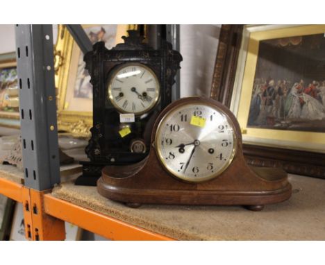 German mantle clock in black ebonised case and curved wooden mantle clock