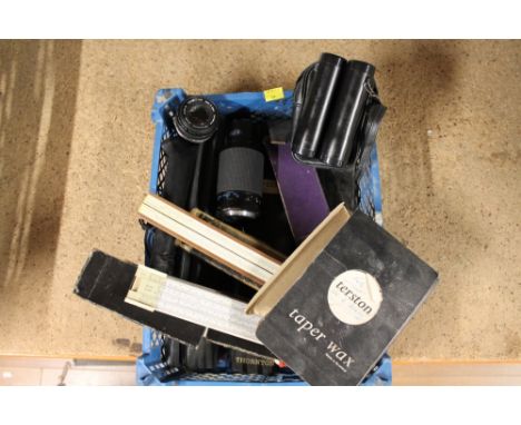 Boxed slide rules, camera lenses and binoculars 