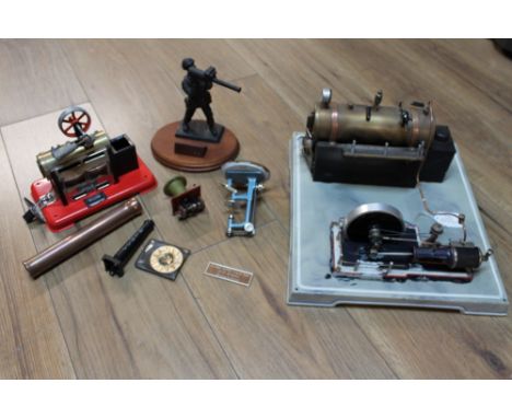 Mamod steam engine with parts, further steam engine in fixed position on base and figurine of soldier 