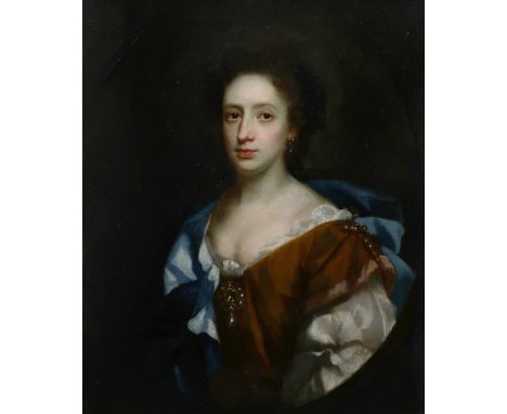 Circle of Sir Peter Lely Portrait of a lady, wearing a brown dress and blue mantle, in a painted oval Oil on canvas 76.7 x 63