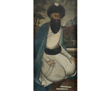 Persian School 19th Century Portrait of a mullah kneeling on a terrace, a landscape beyond Oil on canvas 84.2 x 44.5cm; 33¼ x