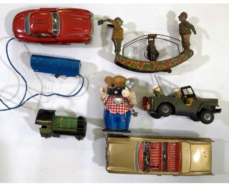 An assortment of collectable toys and models: c 1970s 'Mercedes 350SL' style remote control car, tin bear with camera, Burnet