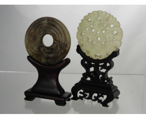 Two Carved Jade Amulets, one white jade depicting a butterfly, the other fungi, both on stands. (2)