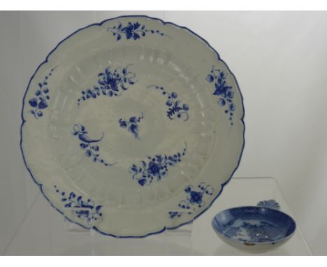A Circa 1800 Blue and White Worcester Plate, together with a porcelain tea strainer.