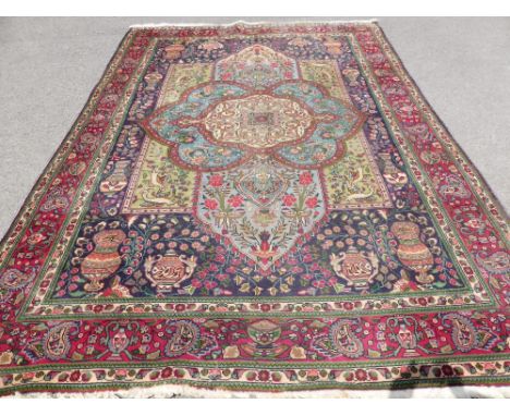 A Persian Tabriz Woollen Hand Knotted Carpet, approx 242 x 365 cms, of typical floral design.