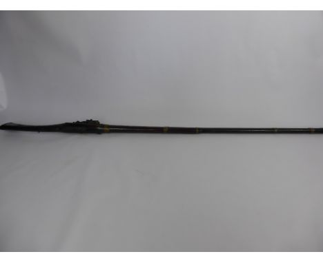 An Antique North African Flintlock Musket, typical tribal manufacture, full stock to muzzle with six ornate brass barrel band