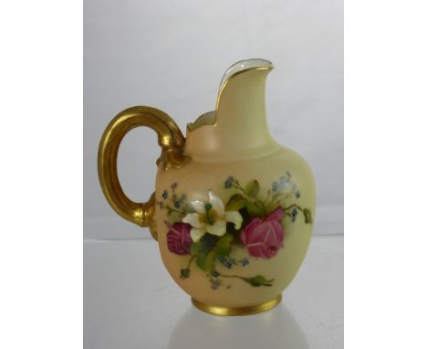A Royal Worcester Blush Ware Jug, having a gilded handle, hand painted with a floral spray, nr 1094.