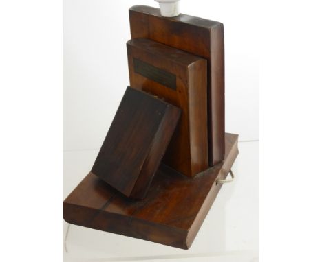 An Antique Wooden Lamp Base, depicting three books, understood to be made from timber of Nelson's warships.