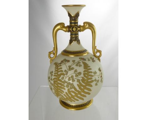 Royal Worcester Ivory Vase, with gilded ferns to body, floral spray with jewelled highlights, gilded handles and neck, mark t