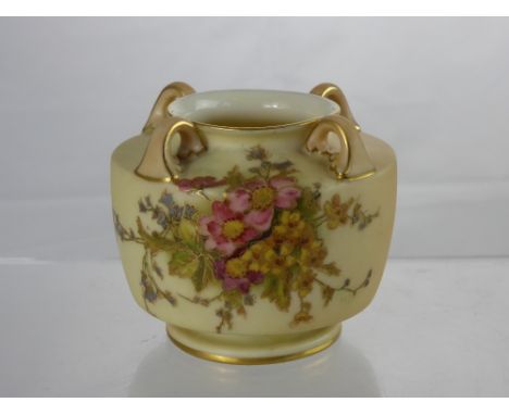 A Royal Worcester Blush Ware Vase, the four handled vase hand painted with a floral spray, nr 991 to base, approx 8 cms.