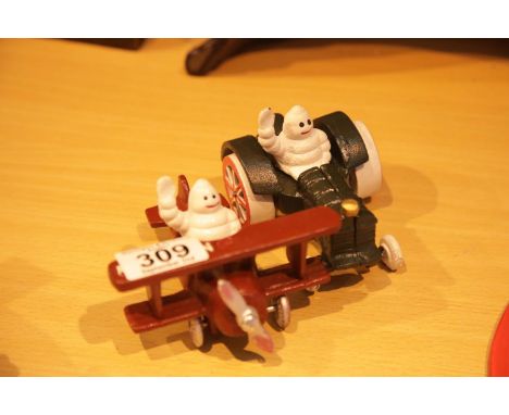Cast iron Michelin man in plane and Michelin man in tractor figurines. P&amp;P Group 2 (£18+VAT for the first lot and £3+VAT 