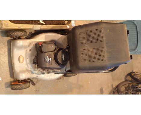 Large Flymo petrol mower with Briggs and Stratton engine. Not available for in-house P&amp;P. 