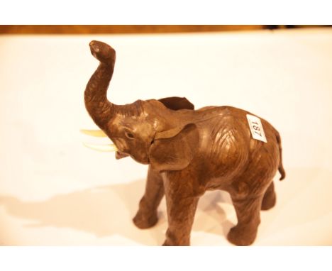 Leather African elephant with trunk raised. H: 30 cm. Not available for in-house P&amp;P. 