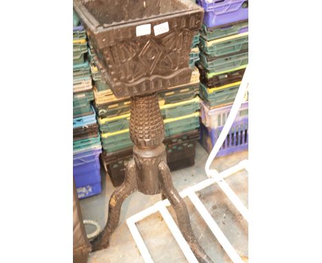 Heavy carved black wooden planter on a tripod support. Not available for in-house P&amp;P. 