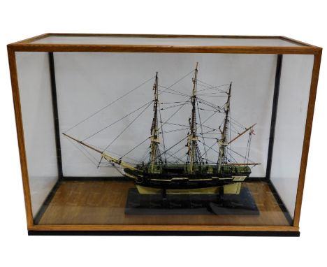 A cased model of a three masted ship. Case size 67cm wide, 47cm high, 29cm deep.