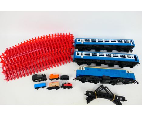 Tri-ang - An unboxed Big Big O gauge train set # RV282 comprising Hymek 'Blue Flyer', 2 x blue coaches and track. They show s