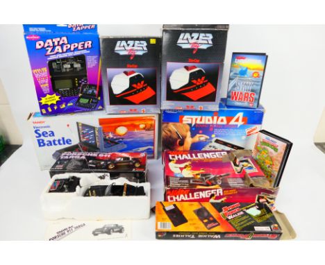 A collection of boxed vintage and retro video and electronic games, and toys. Lot includes a Bandai Video Challenger video ar