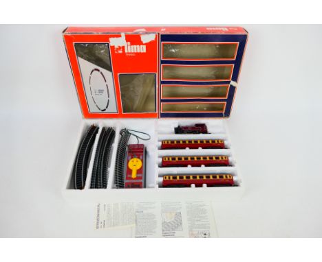 Lima - A boxed vintage Lima 4506W train set comprising of 0-4-0 steam locomotive Op.No.40106 in maroon; with three LMS coache