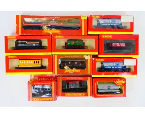Hornby - 11 boxed items of Hornby OO gauge rolling stock. Lot includes R6862 4 Plank Wagon 'Arnold's Sands'; R6106 ECC Hopper
