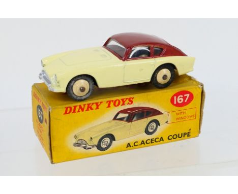 Dinky - A boxed Dinky A.C. Aceca Coupe in brown over cream # 167. The model appears in Near Mint condition with some slight d