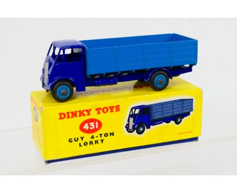 Dinky - A boxed Dinky Guy 4-Ton Lorry # 431 in violet blue with mid blue back and Supertoy hubs with the later yellow and blu