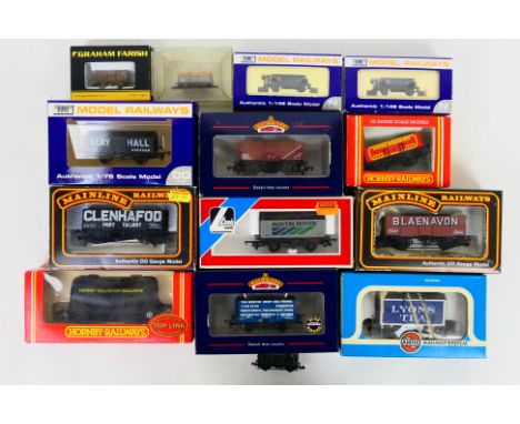 Bachmann - Hornby - Lima - Mainline - Dapol - Nine boxed items of OO gauge freight rolling stock with 4 boxed N gauge wagons.
