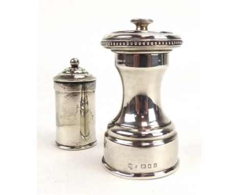 An early 20th century silver pepper grinder of waisted form with beaded border, Goldsmiths &amp; Silversmiths Co. Ltd., Londo