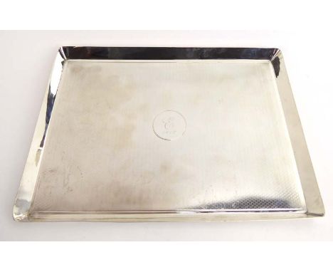 An early 20th century silver tray of rectangular form with honeycomb engine turned decoration, maker CD, London 1916, w. 28 c