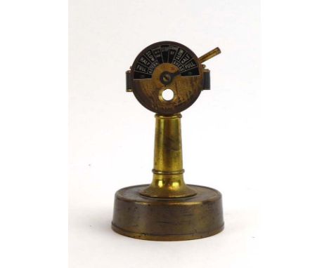 A brass cigar cutter in the form of a chadburn/engine order telegraph, h. 12 cm