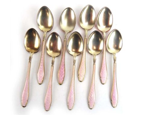 A set of nine silver and parcel gilt spoons decorated in a pale pink enamel, presumably Scandinavian, 3.5 ozs CONDITION REPOR