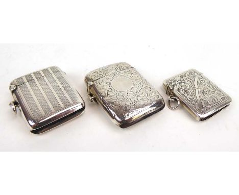 A group of three early 20th century silver vesta cases, with engine turned and foliate engraving, various dates and makers, o