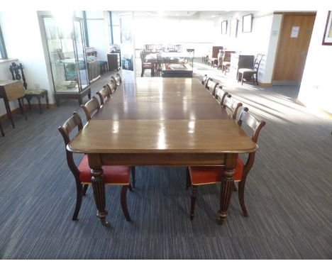 A William IV mahogany extending dining table with three fitted leaves on turned legs with castors, l. 124 to 298 cm CONDITION