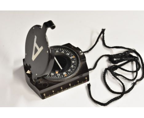 A World War II German Third Reich Wehrmacht army compass, maker marked SW, Bakelite case, black neck cord