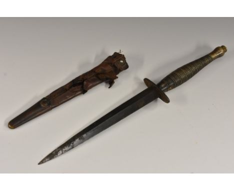 A Fairbairn-Sykes 'ribbed and beaded' F-S Commando fighting knife, 17.5cm pointed blade, the grip with broad arrow mark and i