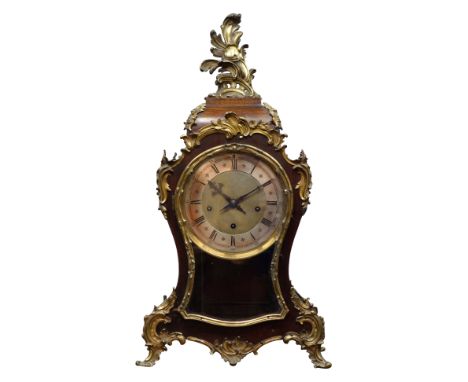 19th century French cartouche shaped mantel clock, with floral ormolu mounts and feet, silvered Roman chapter ring, triple tr
