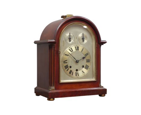 Late 19th century mahogany cased mantel clock, broken arched top with silvered dial and chapter ring, enclosed by bevelled gl