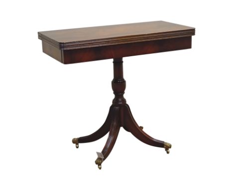 Regency style mahogany card table, rectangular swivel fold over top with rounded corners, baize lined, on turned column with 