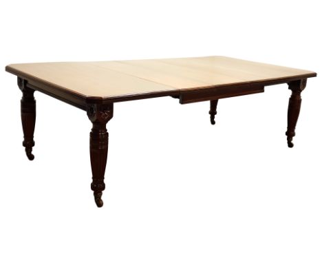 Late Victorian walnut telescopic extending dining table, moulded rectangular top with canted corners, on turned fluted suppor