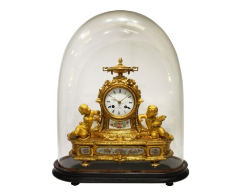 Late 19th century French ormolu mantel clock, decorated with urn pediment, floral swags and engraved detail, putti figural mo