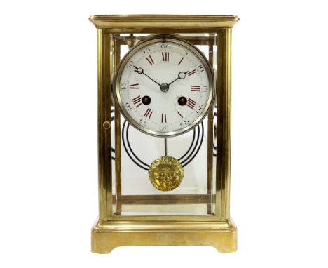 Late 19th century brass and bevel glazed mantel clock, white enamel dial with Roman numerals, twin train movement striking th