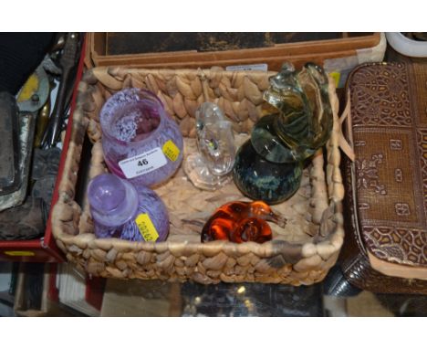A basket containing a Caithness scent bottle and similar vase; two glass paperweights; and a glass owl ornament