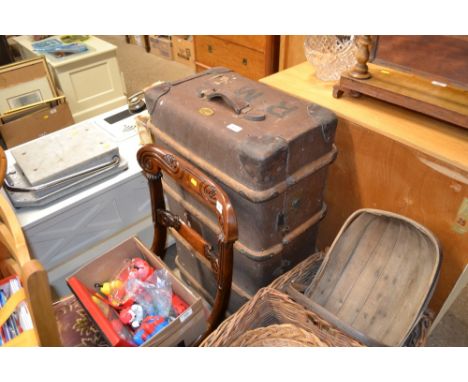 A wooden bound and leather travelling trunk 