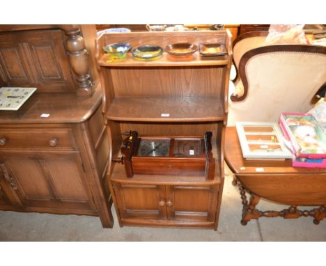 An Ercol elm waterfall bookcase 