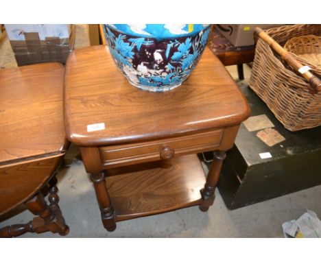 An Ercol elm two tier table fitted single drawer 