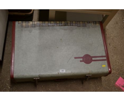 A vintage suitcase full of designed and brand named woman's clothing 