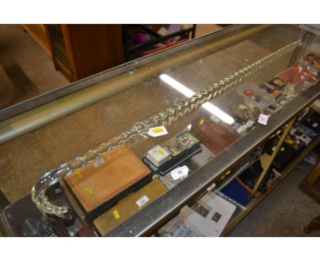A clear glass walking stick 