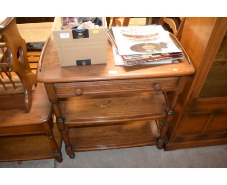 An Ercol three tie side table fitted single drawer