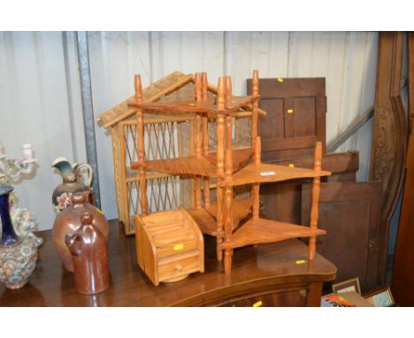 Three pine corner shelves; a small pine stationery rack; and a wicker display shelf 