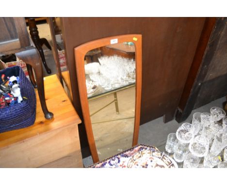 A teak framed mirror