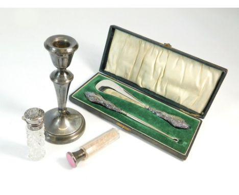 BUTTONHOOK ETC. A cased buttonhook & shoe lift set, in fitted case. Chester 1914. Also, a single 1970's silver candlestick, a